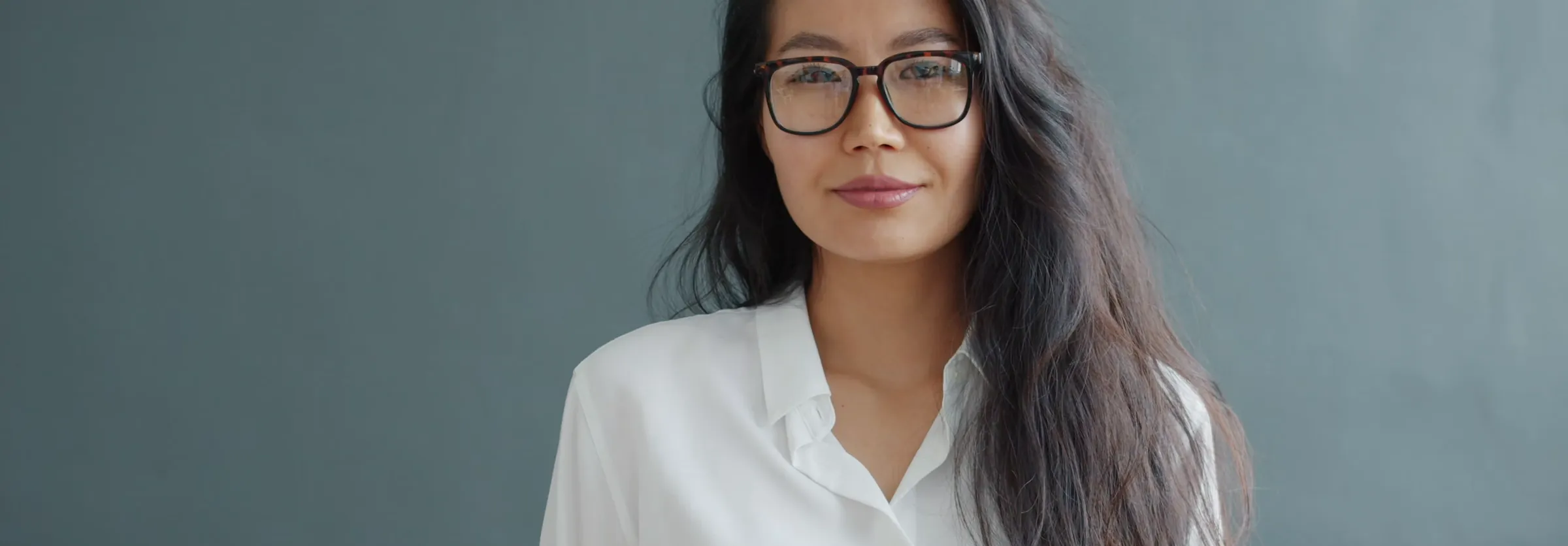 An early-stage founder at her desk in a quiet office